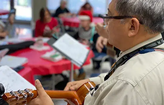 Man playing a ukulele