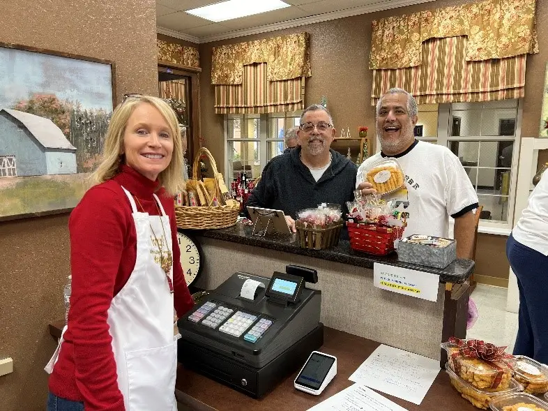 Shoppers checking out in the gift shop